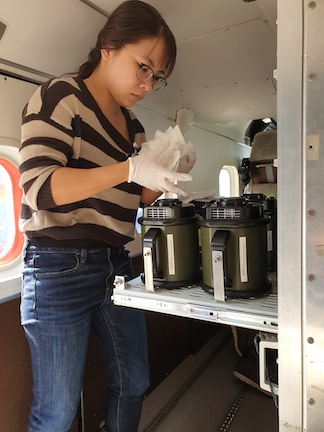 Research associate Carmon Kee prepares SASS® 3100 high-volume air samplers on board the Dornier Do-128